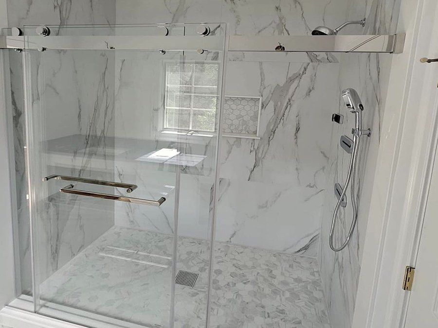 Finished bathroom remodel with glass shower door